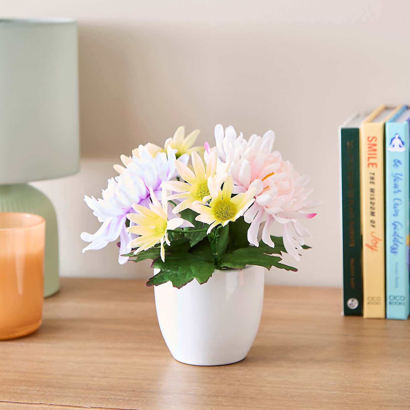 Artificial Floral Arrangement in White Ceramic Plant Pot