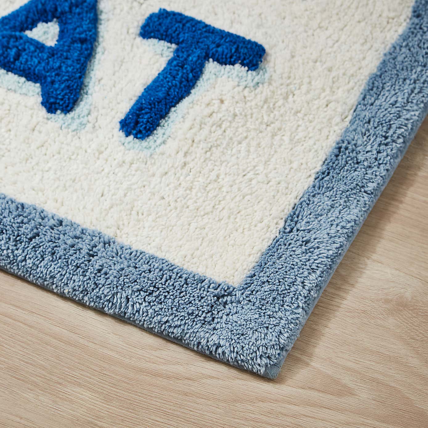 Rinse & Repeat Slogan Bath Mat