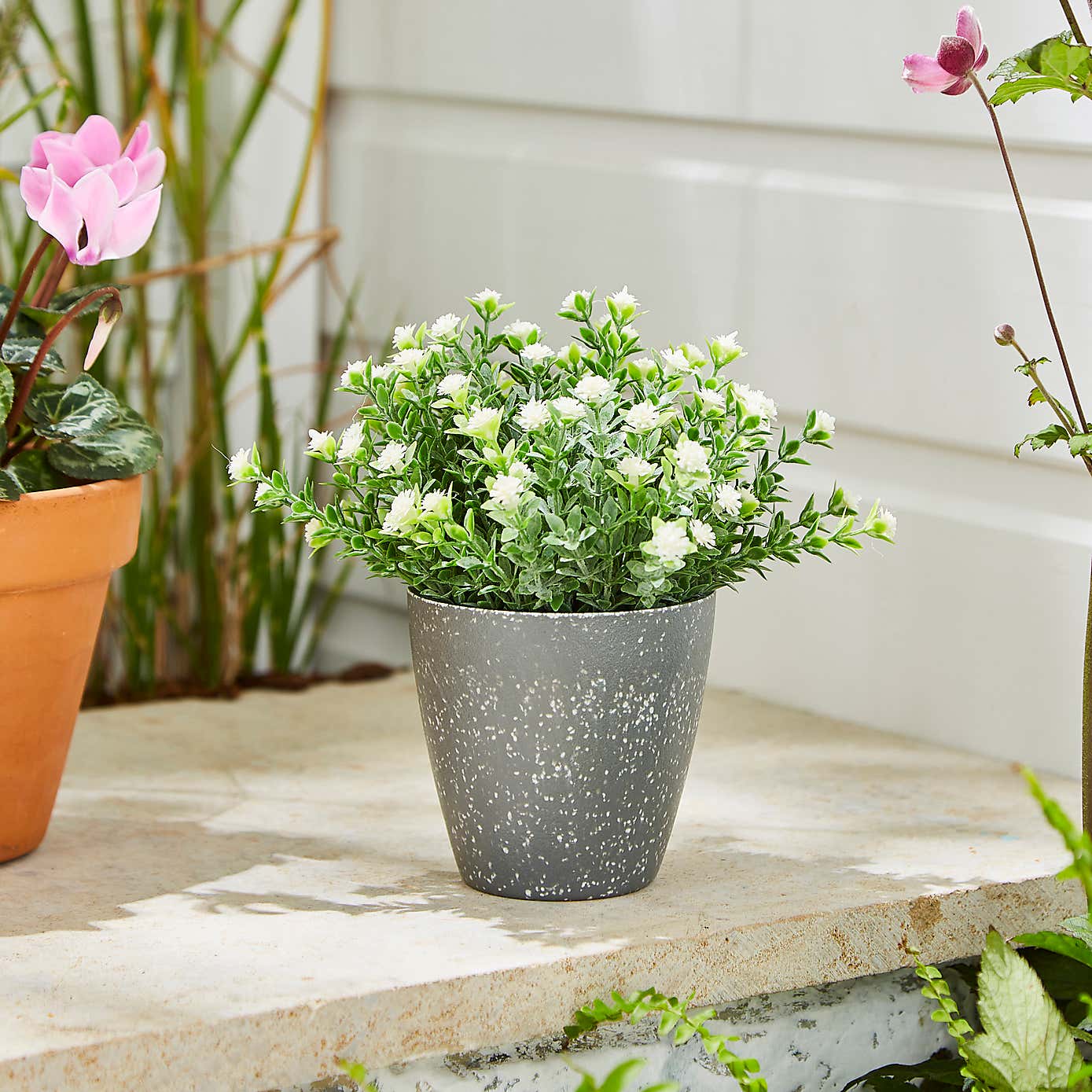 Artificial Flowers in Grey Plant Pot