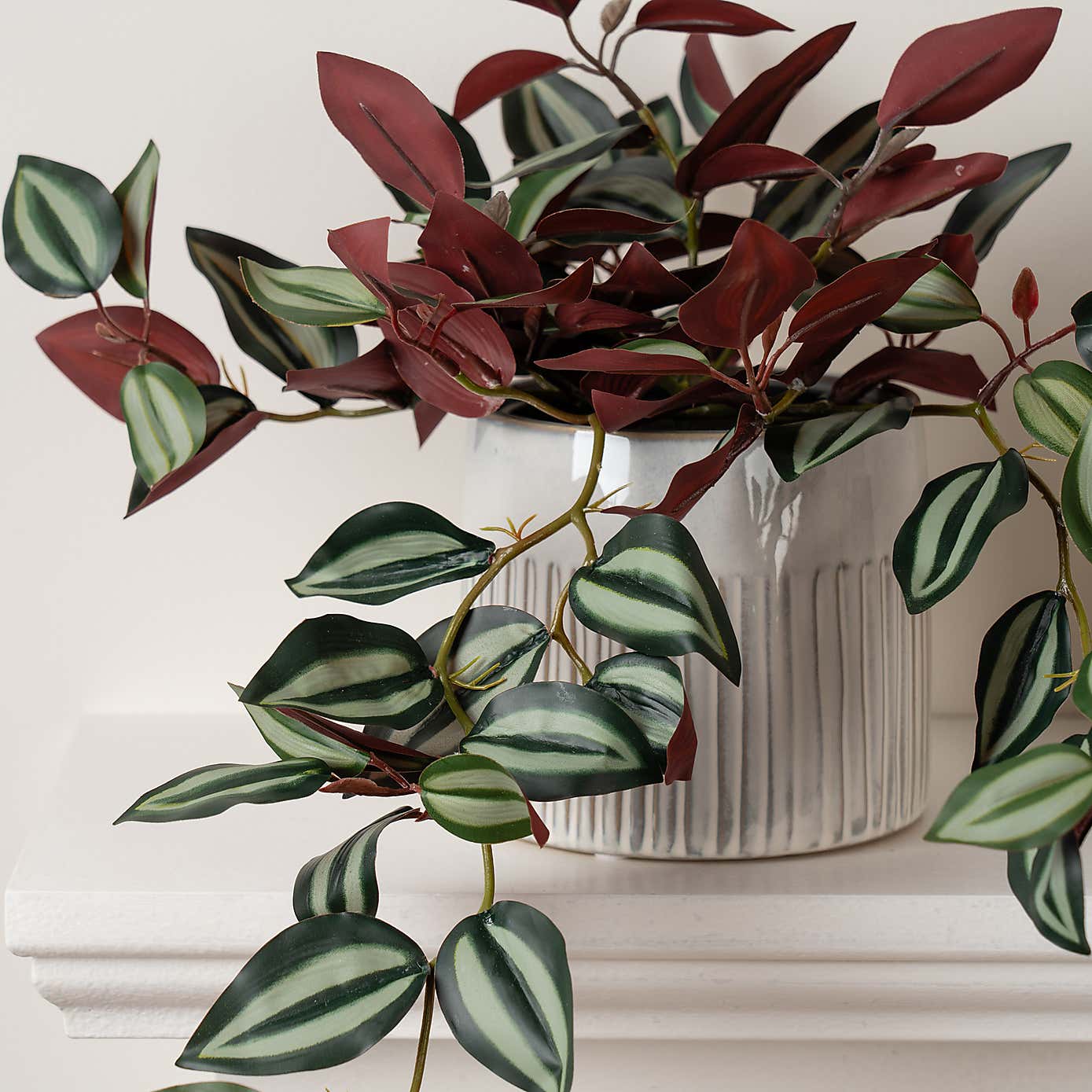 Artificial Violet Trailing Plant in Black Plant Pot