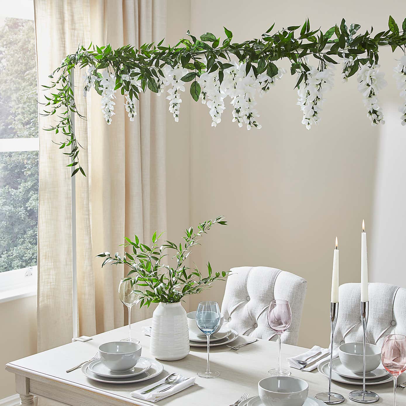 Artificial White Hanging Plan Over Table Display
