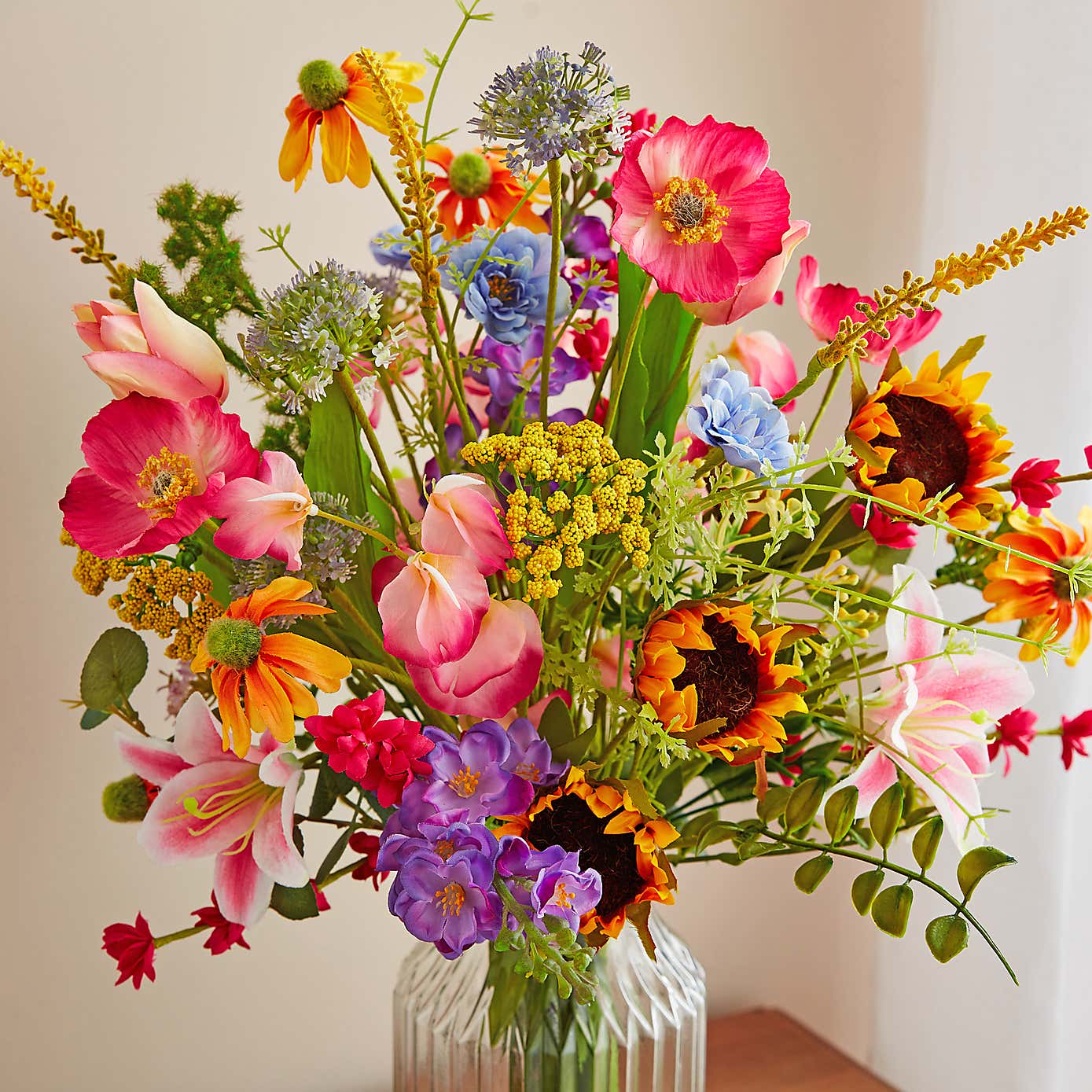 Artificial Bright Floral Bouquet in Ribbed Glass Vase