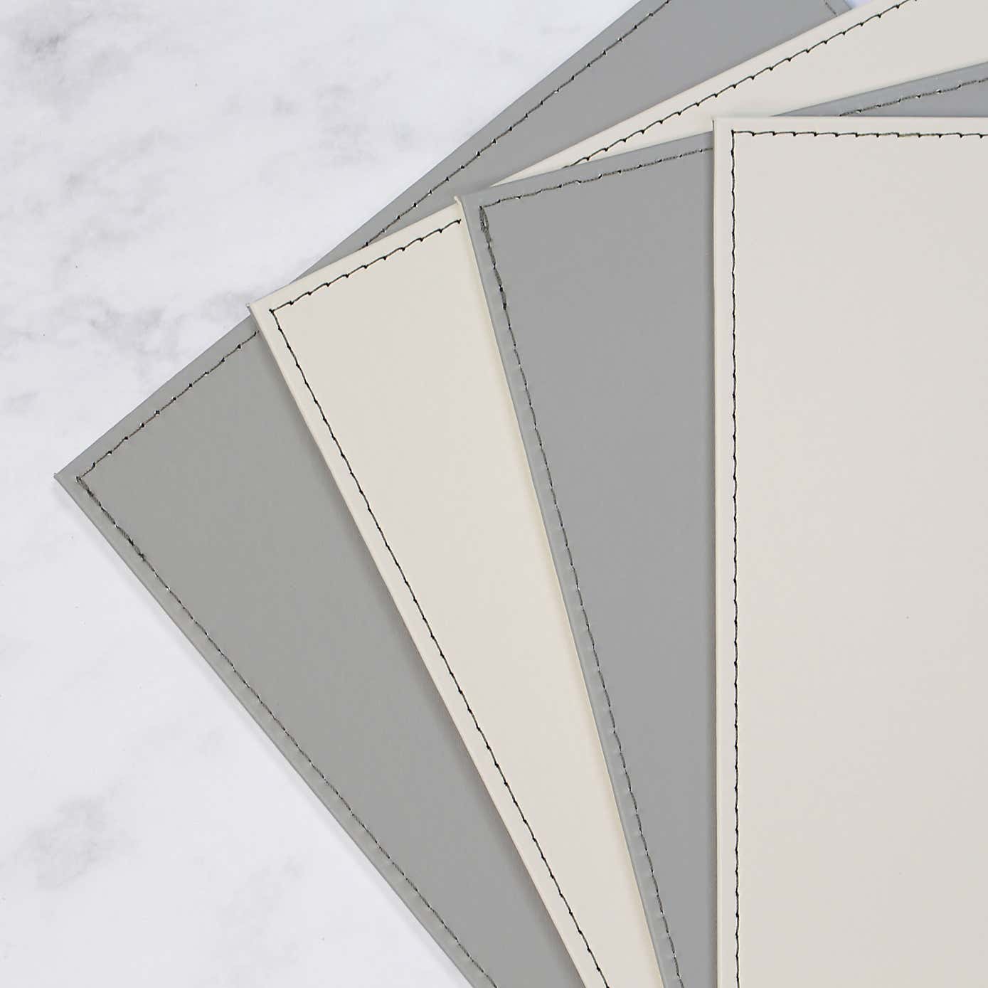 Set of 4 Reversible Cream & Grey Faux Leather Placemats
