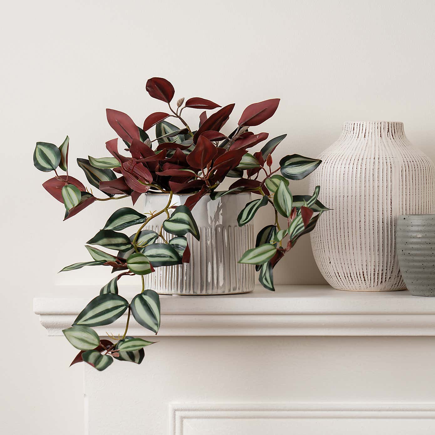 Artificial Violet Trailing Plant in Black Plant Pot