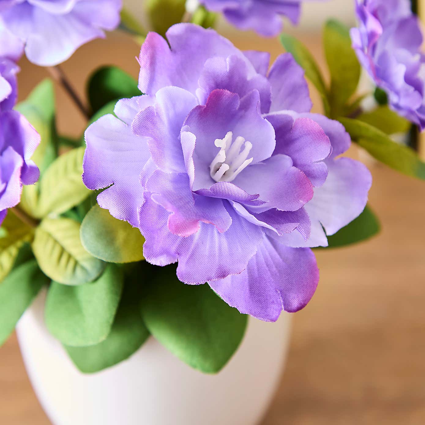 Artificial Blossom Floral in White Ceramic Plant Pot