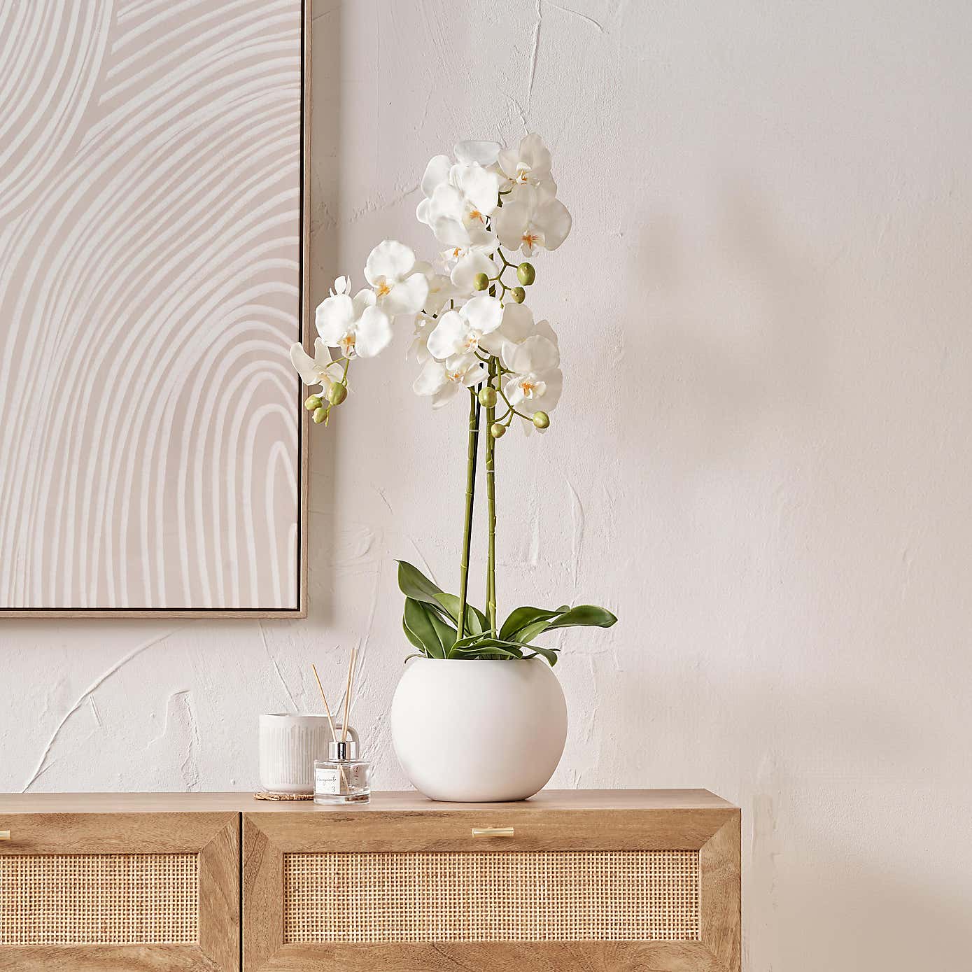 Artificial White Orchid in Rounded White Plant Pot