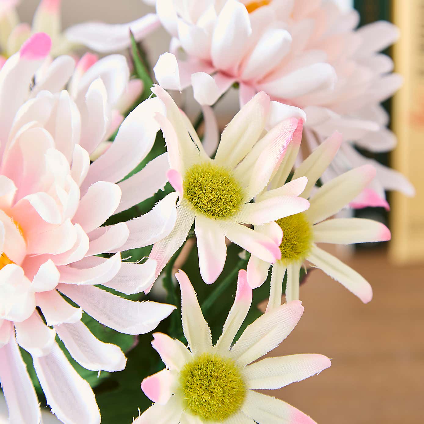 Artificial Floral Arrangement in White Ceramic Plant Pot