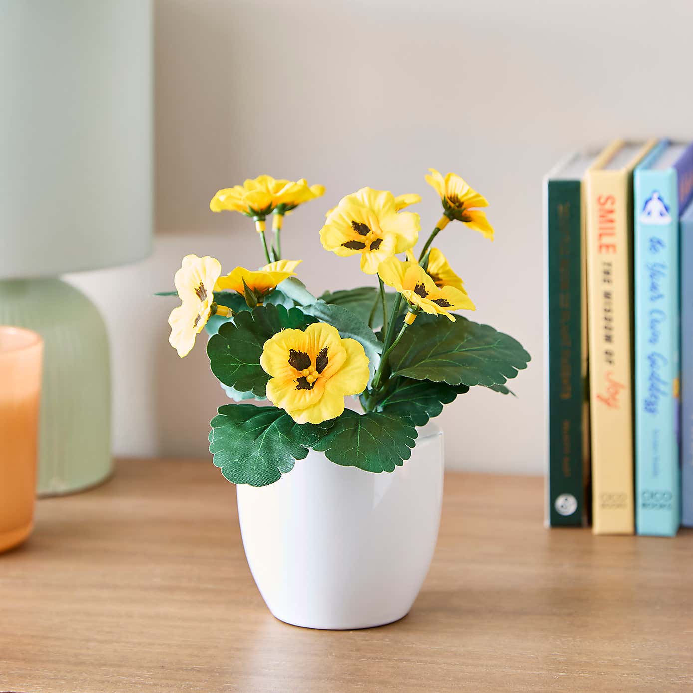 Artificial Yellow Pansy in White Ceramic Plant Pot
